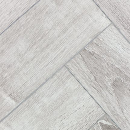 Напольное покрытие виниловый паркет в стиле Herringbone.